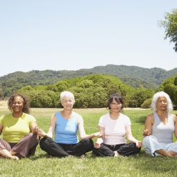 Photo of women meditating.